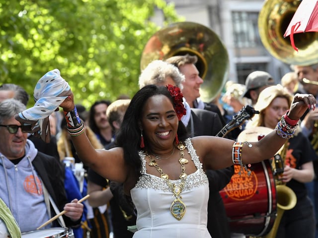 Mayor Lilian Seenoi Bar enjoys the carnival atmosphere at the Jazz Festival’s DLD Second Line Parade Saturday morning. Photo: George Sweeney