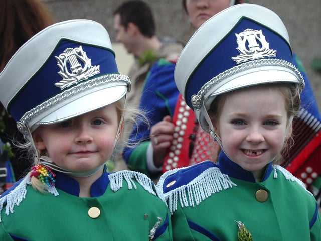 Tamara McDaid, left, and Brogan Roddy lead St Canice's Accordian Band at the Moville St Patrick's Day parade. (1903PG13)