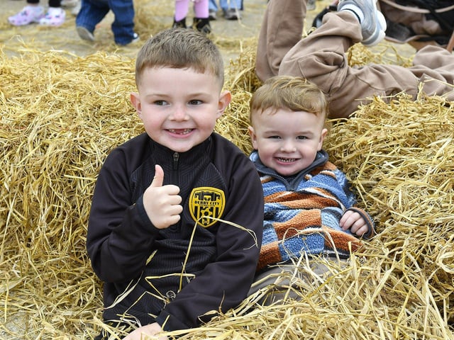 Brothers Luca (5) and Charlie Ray (2) enjoy their visit to the Festive Pumpkin Patch at Ebrington Square on Sunday afternoon. Photo: George Sweeney