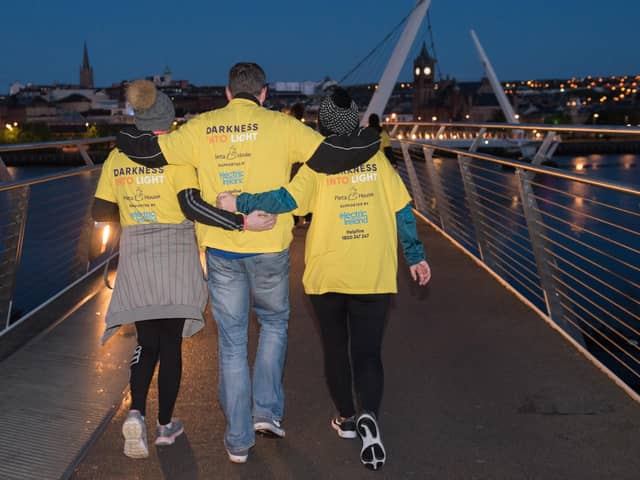 NO FEE FOR REPRODUCTION
The Power of Hope: People from Derry-Londonderry at the Darkness Into Light event in the city along the banks of the River Foyle and across the iconic Peace Bridge. Thousands of people across 202 locations worldwide walked together in hope at this year’s Darkness Into Light, proudly supported by Electric Ireland to spread hope and raise vital funds for those affected by suicide and self-harm.Twelve of the venues were in Northern Ireland spanning the six counties and forming a worldwide invisible chain of hope that stretches from Crossmaglen to Christchurch and from Ormeau Park to Ottawa.   The number of venues is up in Northern Ireland this year from nine to 12 demonstrating clearly the importance and value people place on the opportunity to come together in solidarity and hope to raise awareness of and destigmatise suicide. Picture Martin McKeown. 11.05.19