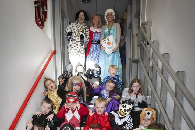 Mrs Gillen, Mrs Gilmour (Classroom Assistant), Miss Lynch (Teacher), Miss Donnelly (Classroom Assistant) and one of the classes all dressed up for Halloween celebrations on Wednesday last.