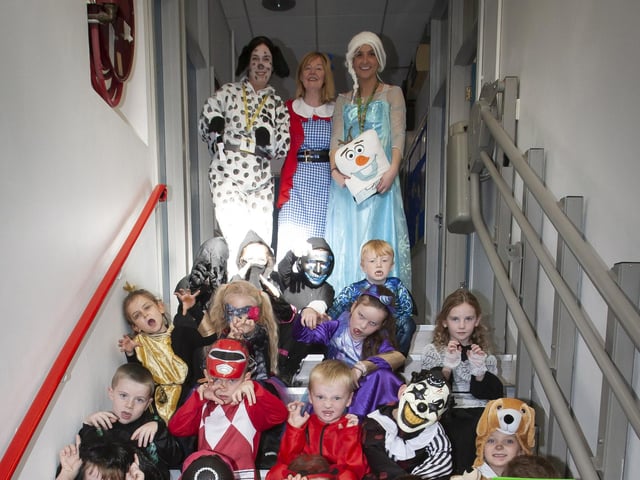 Mrs Gillen, Mrs Gilmour (Classroom Assistant), Miss Lynch (Teacher), Miss Donnelly (Classroom Assistant) and one of the classes all dressed up for Halloween celebrations on Wednesday last.