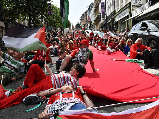 Supporters of the ‘Turn Shipquay Street Red for Gaza’ march on Shipquay Street on Saturday afternoon. Photo: George Sweeney