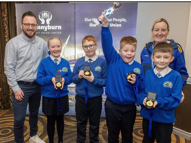 Pennyburn Credit Union School Quiz Competition A Winners St. Paul's P.S. L to R - Frank Doherty (CEO), Sophie, Seamus, Ryan, Lochlainn. See Page 4.