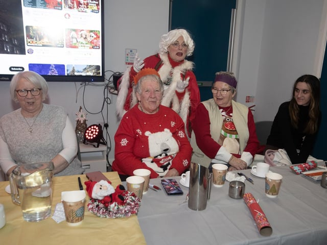 Mrs. Claus entertaining some of the group at last week's Senior Citizens Christmas Party in the Cathedral Youth Club.