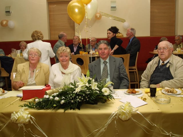 Molly and Charlie in a 'Journal' photograph captured during a celebration in August 2003.