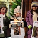 Children carry candles and photographs of children killed in Gaza at a vigil held in Guildhall Square, to mark World Childrens Day, and to remember the lives of children in Gaza. Photo: George Sweeney