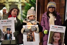 Children carry candles and photographs of children killed in Gaza at a vigil held in Guildhall Square, to mark World Childrens Day, and to remember the lives of children in Gaza. Photo: George Sweeney