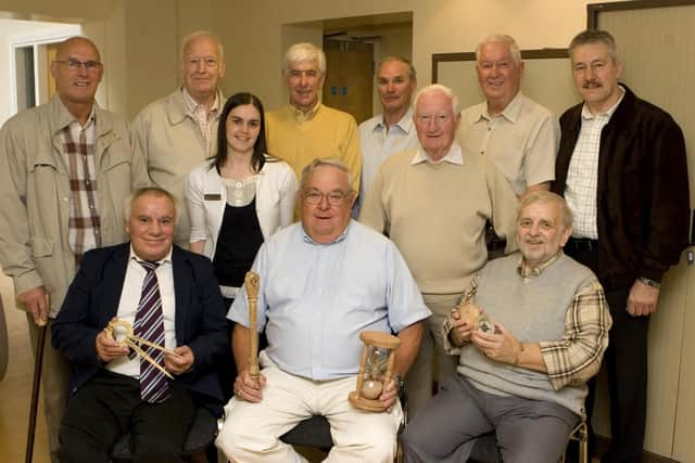 Archie Jack, seated, on left, with the team of divers who discovered La Trinidad Valencera, one of the largest ships in the Armada Fleet which sunk near Kinnagoe Bay in 1588, alongside Charlie Perkinson (centre) and local historian Roy Hamilton (on right). Standing, from left, are Jack Scoltock, Jim Kidd, Fiona Tracey, educational assistant, Heritage and Museum Services, Derry City Council, Patrick Stewart, Michael Morrison, Stan Donaghey, John Davidson and Eddie McMonagle.