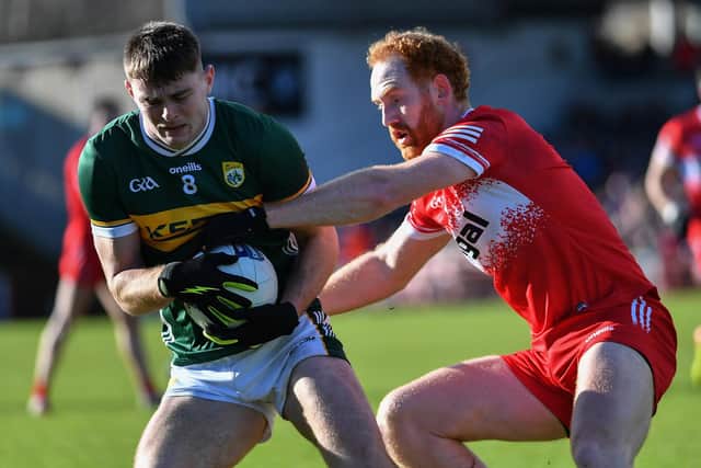 Derry’s Conor Glass tackles Diarmuid O’Connor of Kerry. Photo: George Sweeney