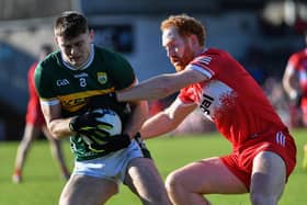 Derry’s Conor Glass tackles Diarmuid O’Connor of Kerry. Photo: George Sweeney