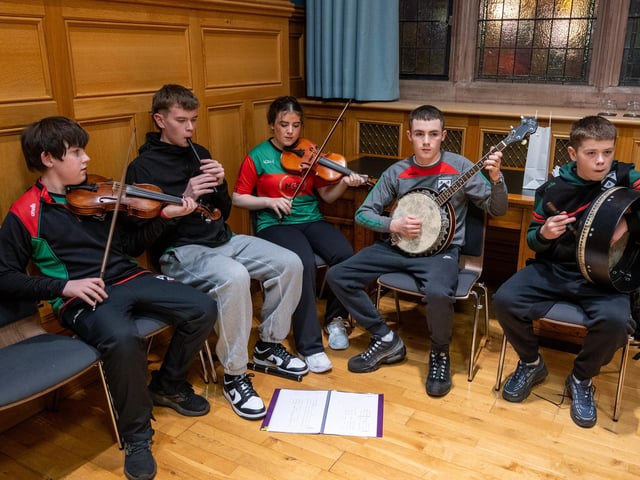 Doire Trasna GAC who are celebrating their 25th Anniversary received a commemorative crystal gift from the Mayor Councillor Ruairi McHugh in the Guildhall to mark their outstanding contribution to sport, community life and promotion of Gaelic games. During the evening the club’s traditional band and Irish dancers entertained guest with performances. Picture Martin McKeown. 22.01.26