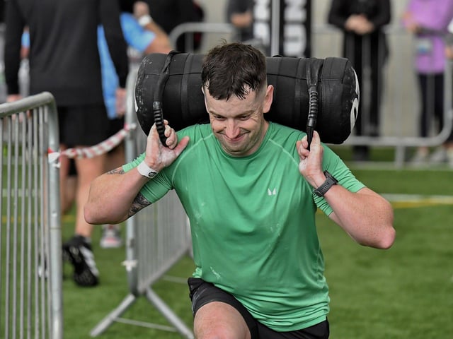 Competitor carries 'Sandbag Lunge' during the Maiden City Hyrox V Fitness Challenge held at Sean Dolans GAC on Saturday. Photograph: George Sweeney