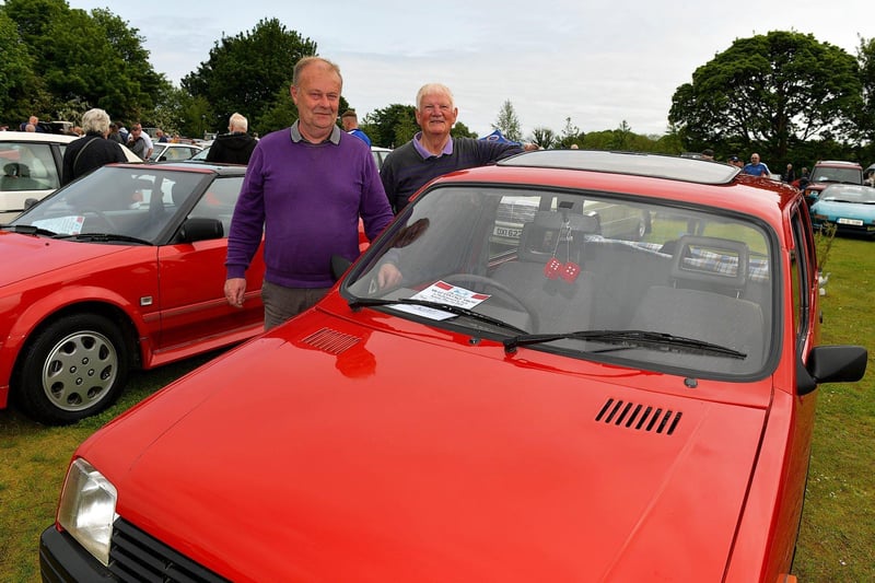 Ivor Lyle and Alan Campbell, from the Eglinton Classic Club, pictured beside Ivor’s 1990 Metro Clubman at the Muff Vintage Show held in the Community Park on Sunday. Photo: George Sweeney.  DER2321GS – 14 