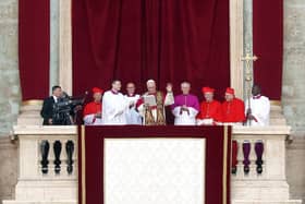 VATICAN CITY, VATICAN - MAY 8: The newly elected Pontiff, Pope Leo XIV is seen for the first time from the Vatican balcony on May 8, 2025 in Vatican City, Vatican. Cardinal Robert Prevost will be known as Pope Leo XIV. White smoke was seen over the Vatican early this evening as the Conclave of Cardinals took just two days to elect the new Pontiff after the death of Pope Francis on Easter Monday. (Photo by Dan Kitwood/Getty Images)