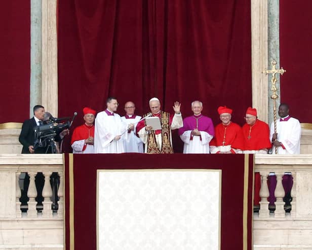 VATICAN CITY, VATICAN - MAY 8: The newly elected Pontiff, Pope Leo XIV is seen for the first time from the Vatican balcony on May 8, 2025 in Vatican City, Vatican. Cardinal Robert Prevost will be known as Pope Leo XIV. White smoke was seen over the Vatican early this evening as the Conclave of Cardinals took just two days to elect the new Pontiff after the death of Pope Francis on Easter Monday. (Photo by Dan Kitwood/Getty Images)