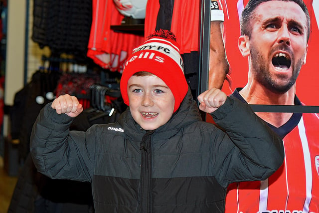 Derry City fan Adam Kelly, aged 8, records a video message for the Derry City team, at O’Neill’s Sports store,  ahead of the Extra.ie FAI Cup final against Shelbourne. Picture: George Sweeney.  DER2244GS – 96