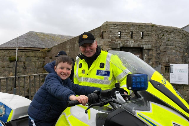 Killian McLaughlin pictured with Garda Shaun Tully at the Emergency Services Showcase held at Fort Dunree, Inishowen, on Sunday. Photo: George Sweeney