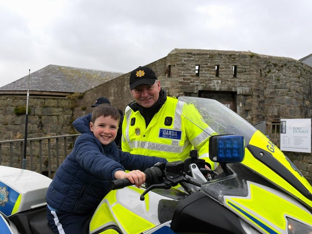 Killian McLaughlin pictured with Garda Shaun Tully at the Emergency Services Showcase held at Fort Dunree, Inishowen, on Sunday. Photo: George Sweeney