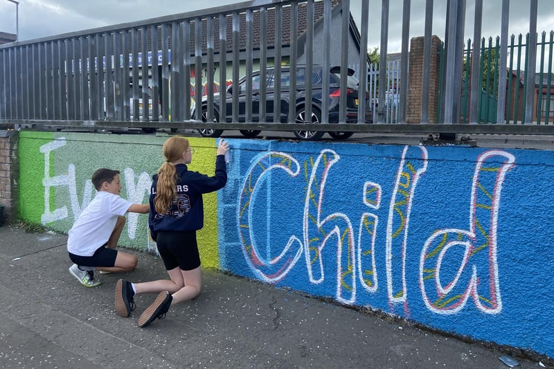 Holy Child students working on their 'Every Child, Every Chance, Every Day' mural.