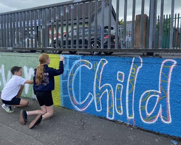 Holy Child students working on their 'Every Child, Every Chance, Every Day' mural.