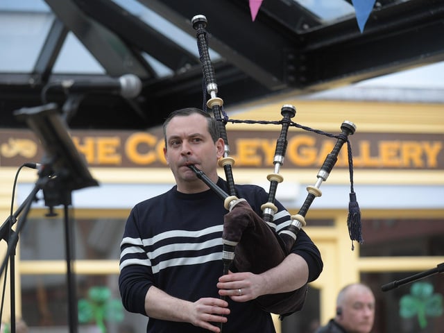 Piper playing in the Craft Village. Photo: George Sweeney.