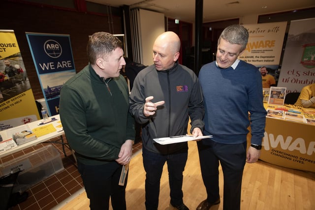 Project Director at the Old Library Trust George McGowan in discussion with the Public Health Authority's Emmet Lynch and Paddy McEldowney on Tuesday night.