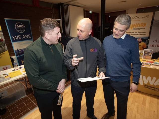 Project Director at the Old Library Trust George McGowan in discussion with the Public Health Authority's Emmet Lynch and Paddy McEldowney on Tuesday night.