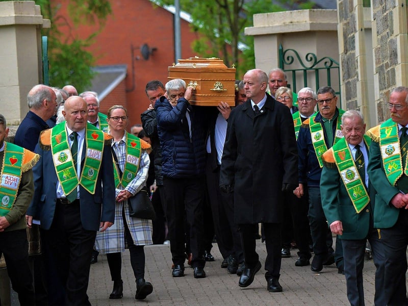 May 2023: Members of the Ancient Order of Hibernians provide a guard of honour at the funeral of former Derry City player and manager Jim ‘Jimbo’ Crossan, at the Requiem Mass held in the Long Tower Church.   Photograph: George Sweeney
