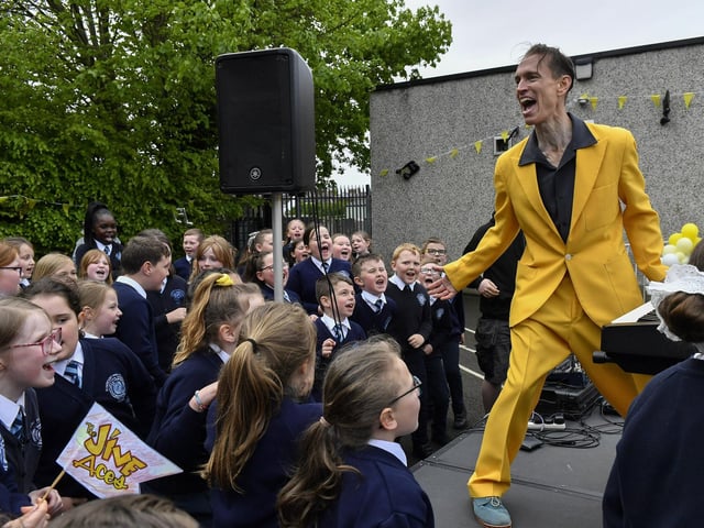 Vince Hurley from the Jive Aces entertaining pupils from Rosemount Primary School during the band’s visit to the school on Thursday morning. Photo: George Sweeney