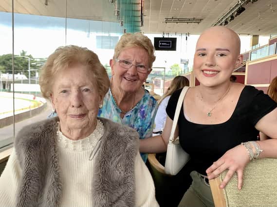 Eileen McDevitt (left) who was celebrating her 104th birthday at Lifford Stadium on Sunday with her family. Maime Clarke (centre) and Maisie Simpson (right).
