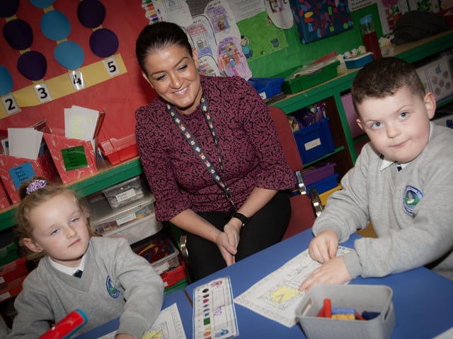 Mrs. Catherine Hegarty pictured with pupils from her P1 class at Sacred Heart PS, Waterside this week. (Photos: Jim McCafferty Photography)