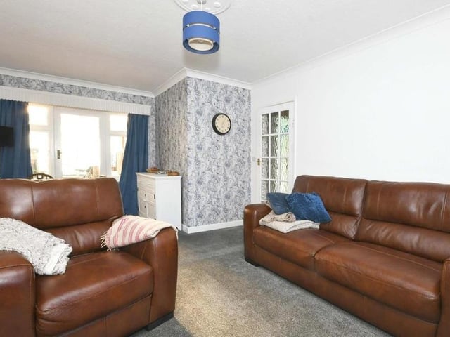 A second shot of the lounge/diner, which is the ideal place to relax in comfort. A single-glazed door at the back leads to the conservatory.
