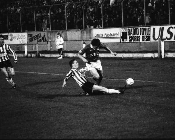 Paul Curran puts in a crunching tackle on Peter Beardsley
