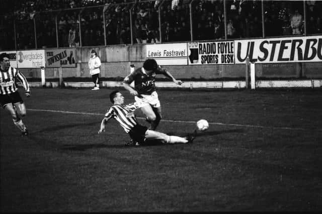 Paul Curran puts in a crunching tackle on Peter Beardsley