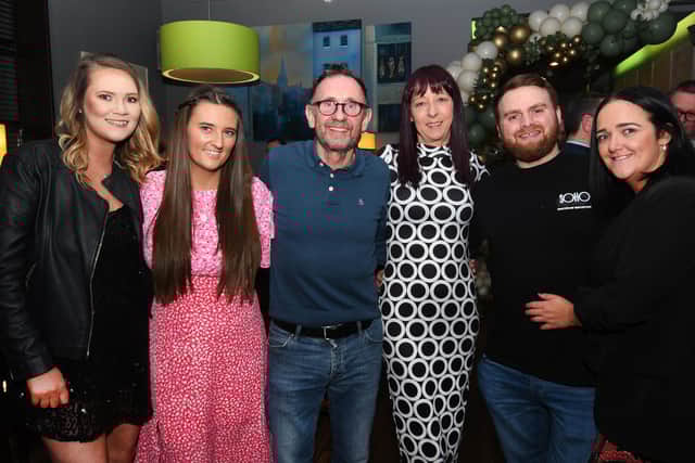 Mark Caithness pictured with some of The Exchange staff.