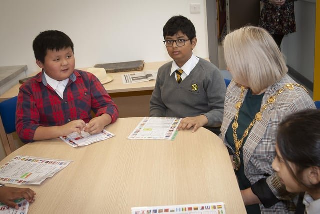 Two of the new pupils at Model PS, Evan and Ifikharur in conversation with Mayor Sandra Duffy on Monday last.