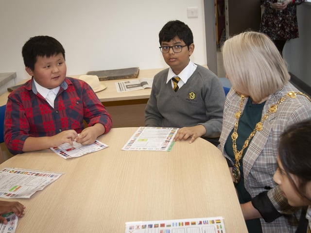Two of the new pupils at Model PS, Evan and Ifikharur in conversation with Mayor Sandra Duffy on Monday last.