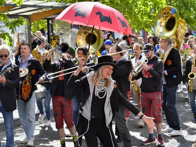 Angela and her NOLA Brass Squad playing at the Jazz Festival’s DLD Second Line Parade Saturday morning. Photo: George Sweeney