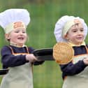 Pupils at Gaelscoil Eadain Mhoir flipping pancakes in 2012.