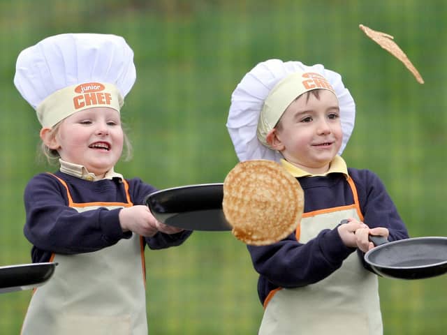 Pupils at Gaelscoil Eadain Mhoir flipping pancakes in 2012.