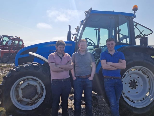 Young men catching up before the Tractor Run begins.