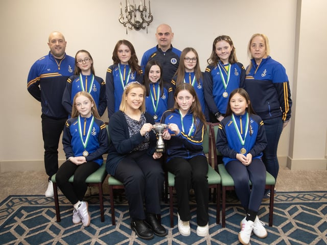 Eglinton Eagles u-11 receive the Summer Plate from Kerri Pyne, Derry Credit Union, at the D&D Youth FA awards at the Waterfoot Hotel on Sunday night last. Included are coaches John Wray, Stephen Thompson and Mary McCafferty. (Photos: Jim McCafferty Photography)