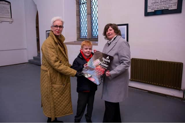 Rev Canon Judi McGaffin, Oran Culligan, Lorraine Hill look forward to the 'Spark to A Flame' flower festival in Buncrana.