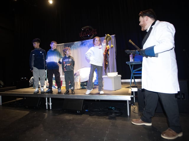 Local children taking part in one of the Mad Scientist's experiments during Saturday's event at New Gate.