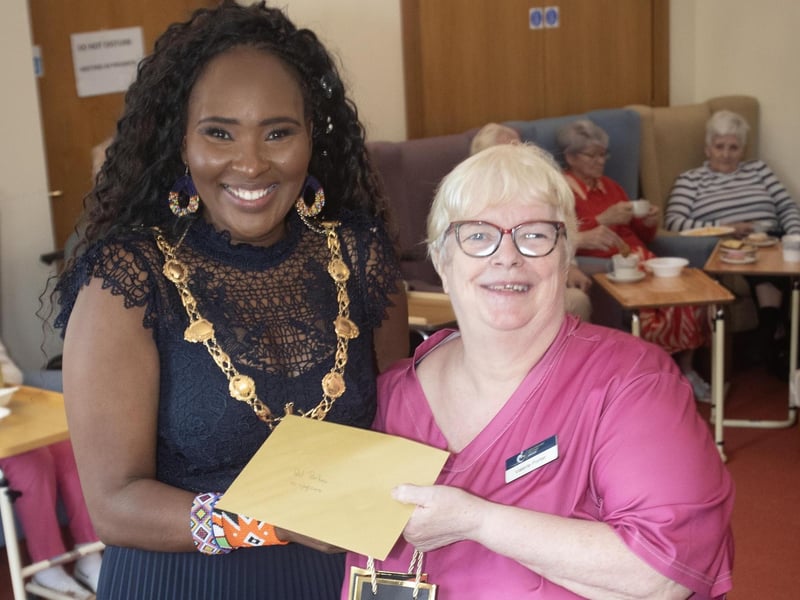 Valerie Porter being presented with an award from the Mayor, Lillian Seenoi-Barr for ten years service at Longfield Care Home on Thursday afternoon.