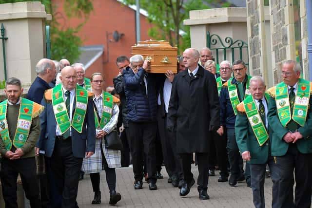 Members of the Ancient Order of Hibernians provide a guard of honour at the funeral of former Derry City player and manager Jim ‘Jimbo’ Crossan, at the Requiem Mass held in the Long Tower Church on Friday morning.   Photograph: George Sweeney. DER2320GS – 88