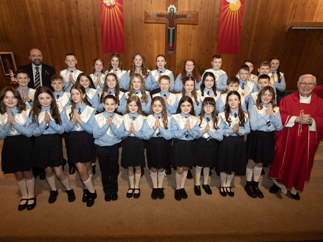 HOLLYBUSH PS CONFIRMATION . . . . .Pupils from Francis Mallon's P7 class at Hollybush Primary School who received the Sacrament of Confirmation from Fr. Colum Clerkin at Our Lady of Lourdes Church, Steelstown on Wednesday afternoon last. Included is Mr. Feargal Friel, Principal. (Photos: Jim McCafferty Photography)