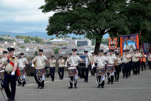 The William King Memorial Band march on Derry Walls during the Twelfth of July. Photo: George Sweeney. DER2128GS – 016