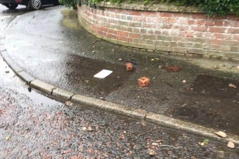 Bricks lying on the pavement near housing at Iniscarn Crescent after police were attacked during a security alert on Tuesday.